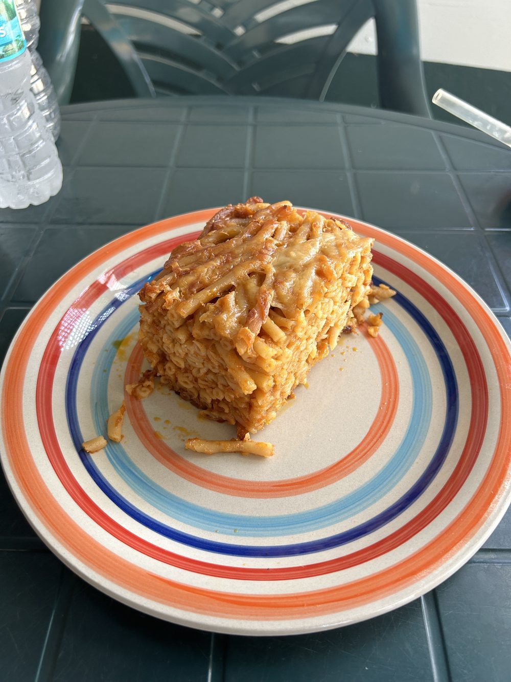 Baked macaroni pie slice with golden cheesy crust